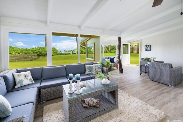 sunroom / solarium with an outdoor hangout area, ceiling fan, and beam ceiling