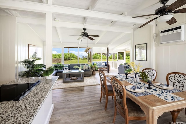 sunroom with beam ceiling and an AC wall unit