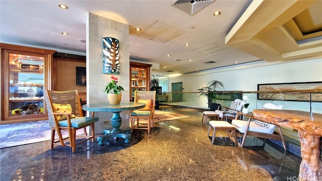 dining space with visible vents and granite finish floor