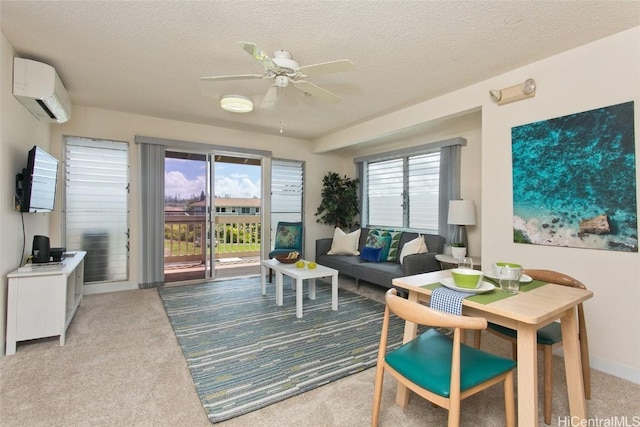 interior space with carpet floors, a wealth of natural light, a textured ceiling, and a wall mounted AC