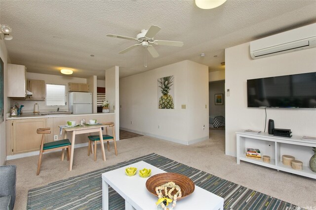 95-1050 Makaikai St Unit 14H, Mililani, HI 96789 - living area featuring light colored carpet, ceiling fan, a wall unit AC, and a textured ceiling