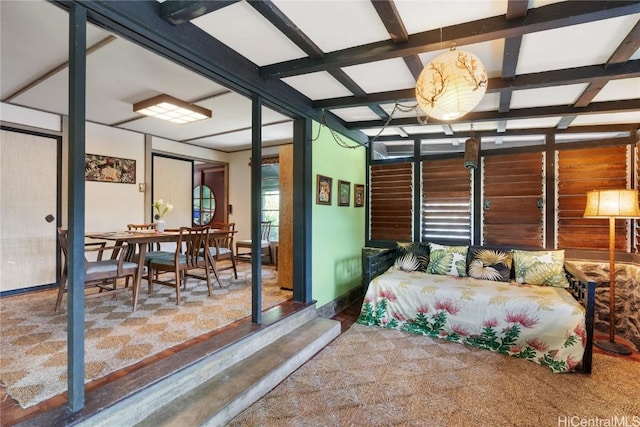 bedroom featuring beam ceiling and coffered ceiling