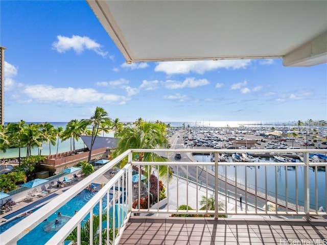 balcony featuring a water view