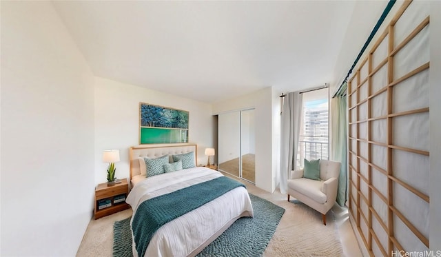 carpeted bedroom with a closet