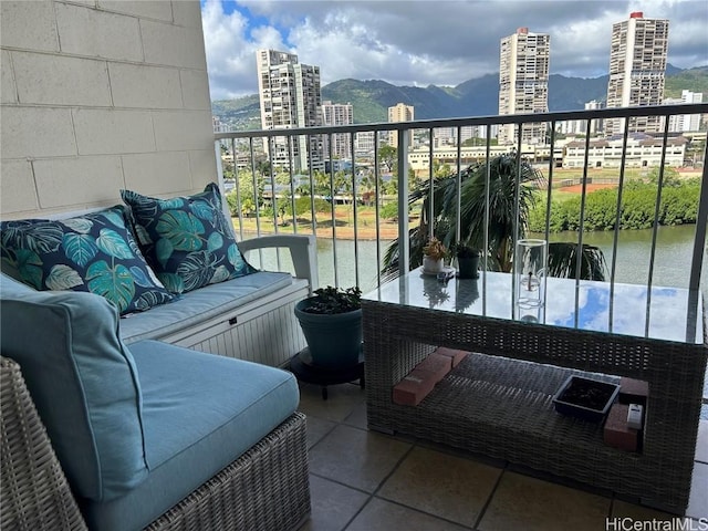 balcony with a mountain view, a view of city, and outdoor lounge area