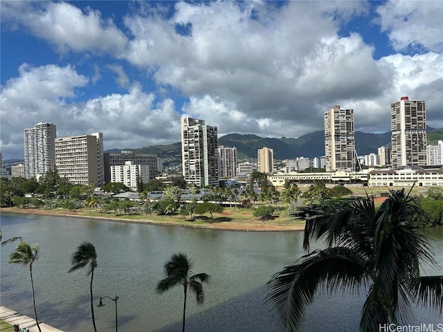 property view of water with a mountain view and a view of city