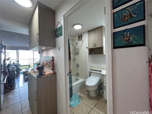 full bathroom featuring visible vents, toilet, shower / bath combo, a textured ceiling, and tile patterned flooring