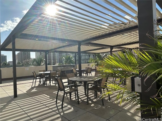 view of patio / terrace with outdoor dining area and a pergola