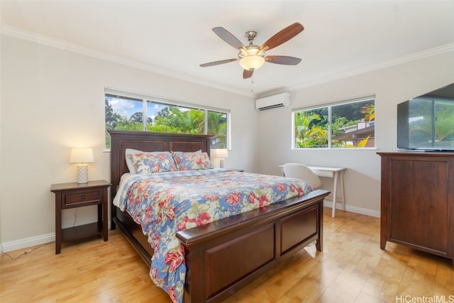 bedroom featuring ornamental molding, an AC wall unit, and light wood-style floors