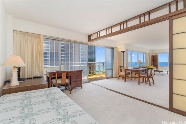 bedroom featuring carpet floors and access to outside