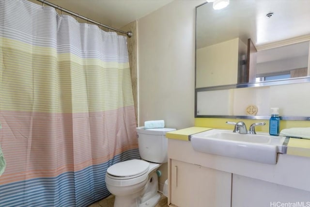 bathroom featuring toilet, curtained shower, and vanity