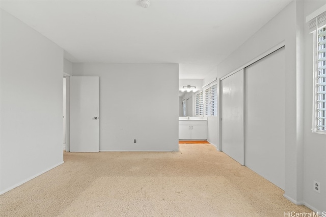 empty room featuring plenty of natural light and carpet flooring