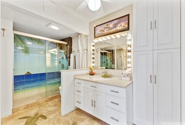 full bath with toilet, a shower stall, tile patterned flooring, and vanity