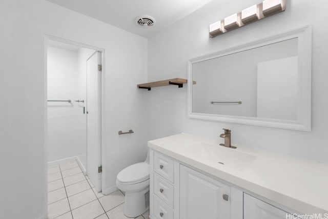 bathroom featuring tile patterned flooring, visible vents, toilet, and vanity