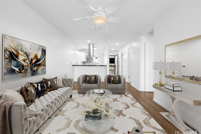 living room featuring recessed lighting, wood finished floors, and a ceiling fan