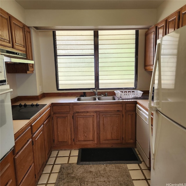 6770 Hawaii Kai Dr Unit 708, Honolulu, HI 96825 - kitchen featuring white appliances, healthy amount of natural light, brown cabinetry, and light flooring