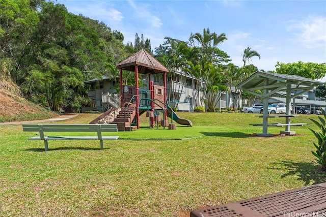 community play area featuring a lawn