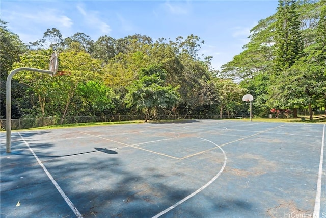 view of basketball court with community basketball court and fence