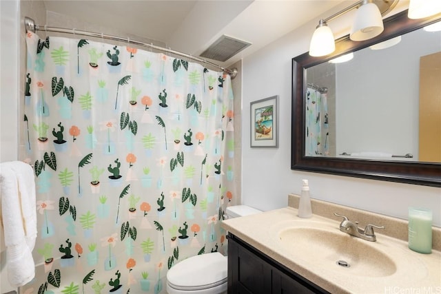 bathroom with visible vents, toilet, vanity, and a shower with curtain