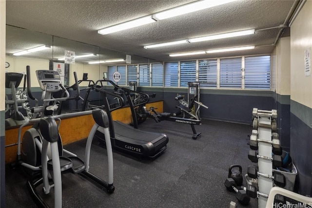 gym with a textured ceiling