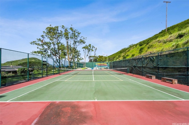 view of sport court with fence and community basketball court