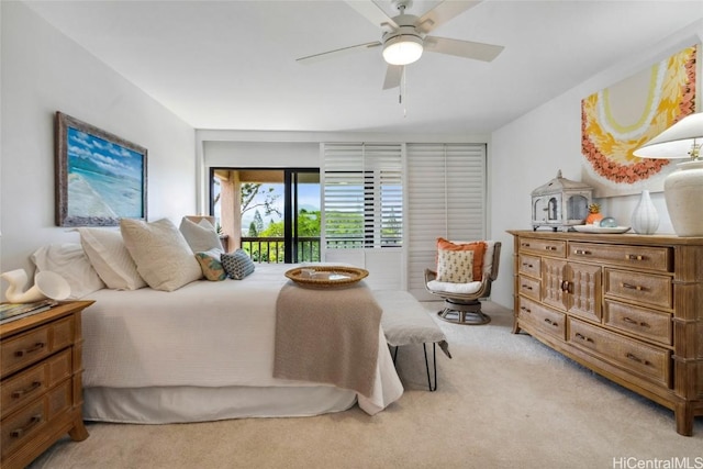 bedroom with access to outside, light colored carpet, and ceiling fan