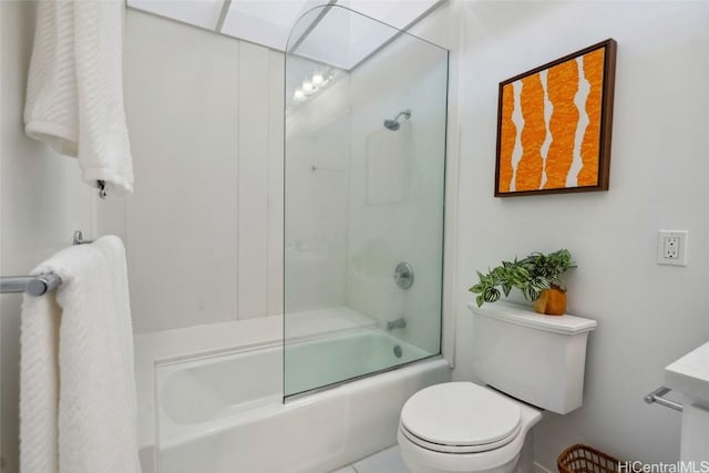 bathroom with shower / bath combination with glass door and toilet