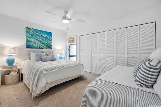 carpeted bedroom with a closet and a ceiling fan