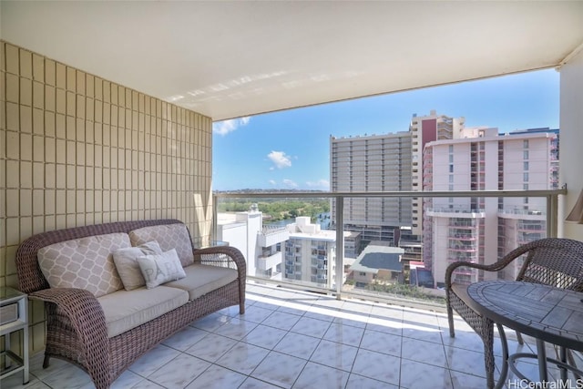 balcony with a view of city and an outdoor living space