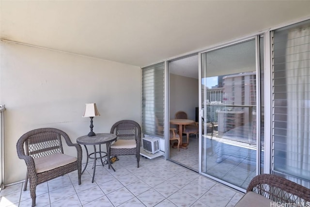 living area with floor to ceiling windows