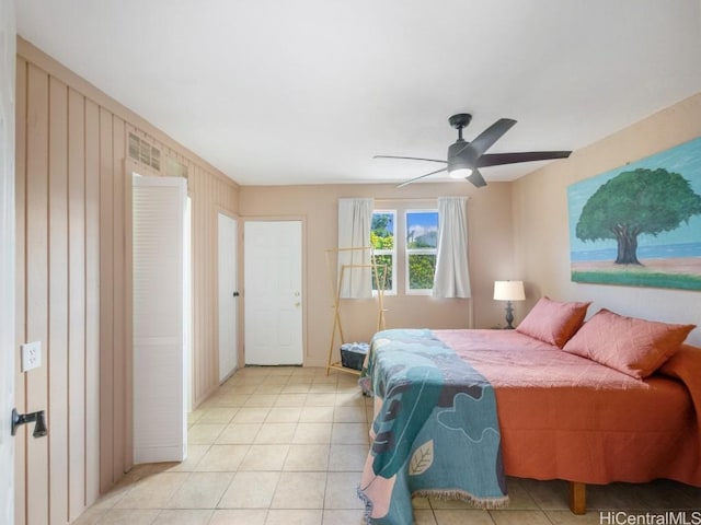 bedroom with light tile patterned floors and ceiling fan