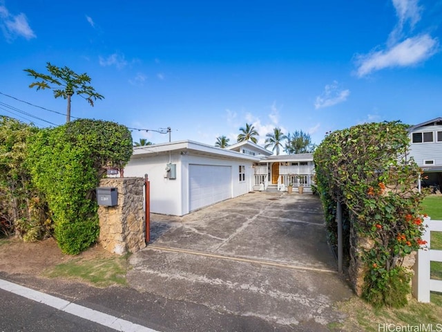 view of front of house featuring driveway and a garage