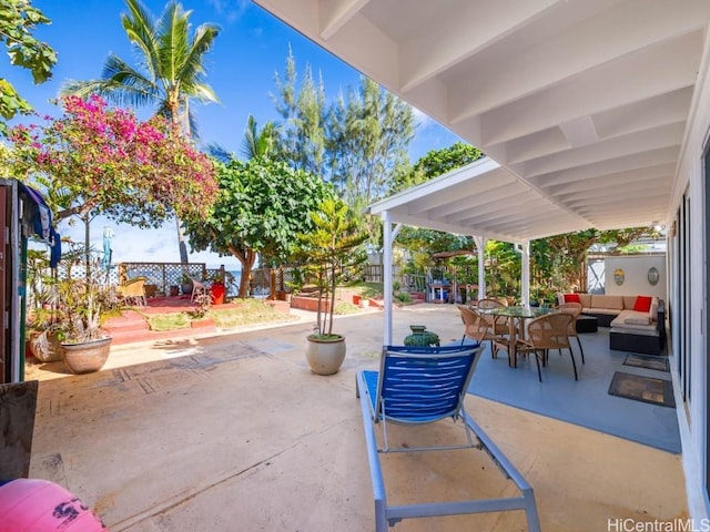 view of patio / terrace with fence and an outdoor living space