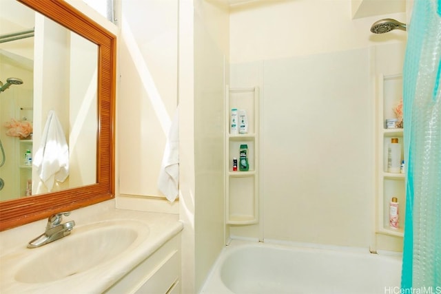 bathroom with shower / bathing tub combination and vanity