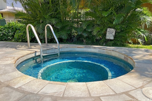 view of swimming pool with a community hot tub and a sink