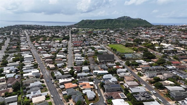 birds eye view of property with a mountain view and a residential view