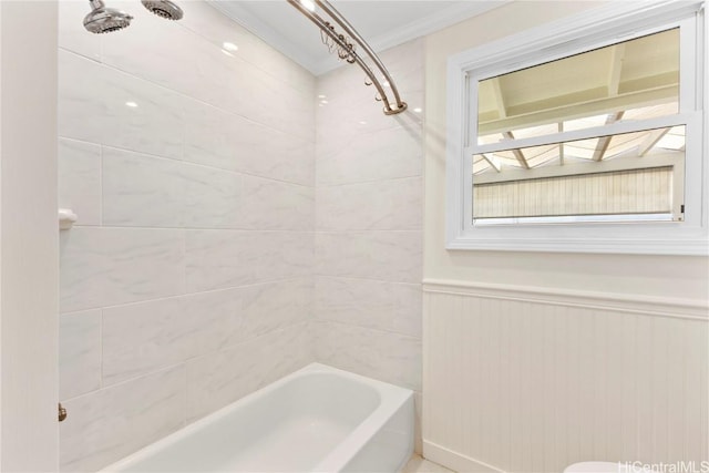 bathroom with a wainscoted wall, ornamental molding, and tub / shower combination