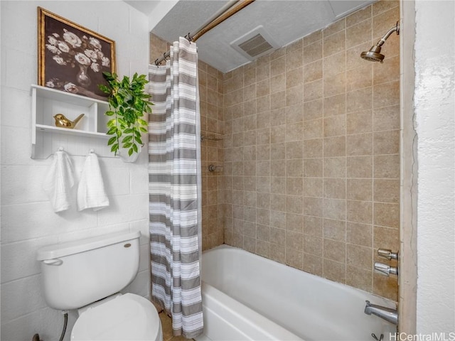 full bathroom featuring toilet, visible vents, and shower / tub combo with curtain