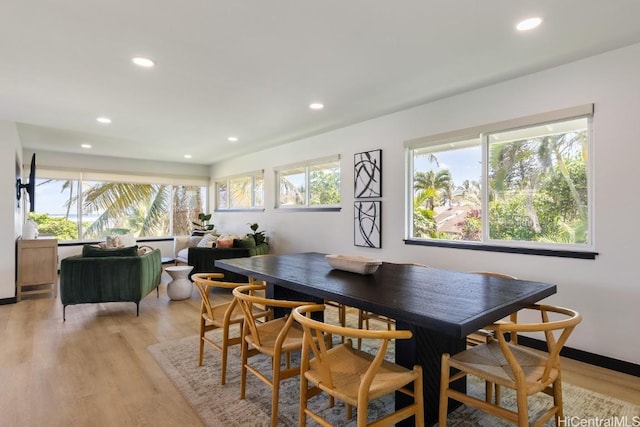 dining area with light wood-style floors and recessed lighting