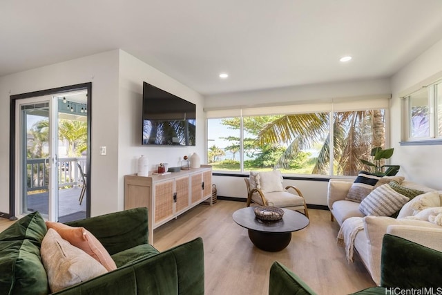 living area featuring recessed lighting and light wood finished floors