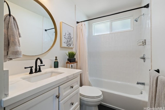 bathroom with shower / bath combo, vanity, and toilet