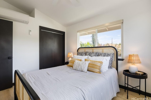 bedroom featuring lofted ceiling, ceiling fan, wood finished floors, and an AC wall unit