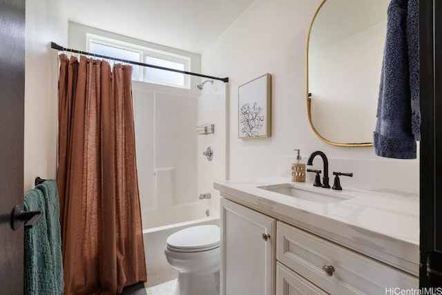 bathroom featuring toilet, shower / bath combo, and vanity