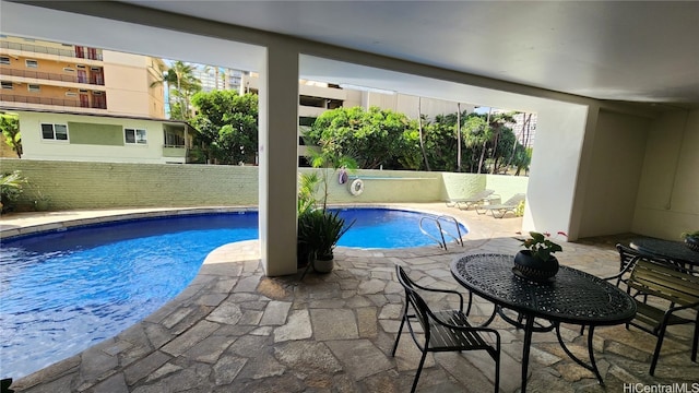 view of pool featuring a patio area and a fenced in pool