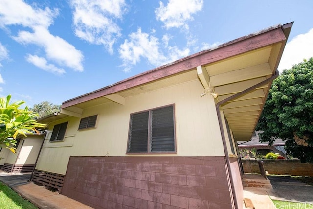 view of side of home featuring entry steps