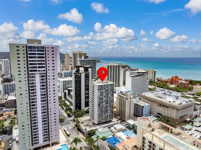 birds eye view of property featuring a water view and a view of city