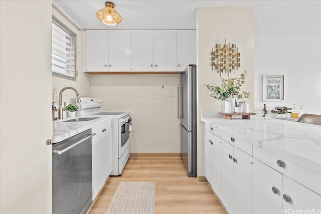 45-342 Lilipuna Rd Unit 307, Kaneohe, HI 96744 - kitchen featuring stainless steel appliances, light wood-type flooring, white cabinetry, and light stone counters