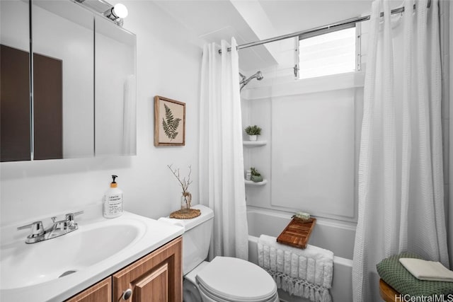 full bathroom with vanity, toilet, and shower / bath combo with shower curtain