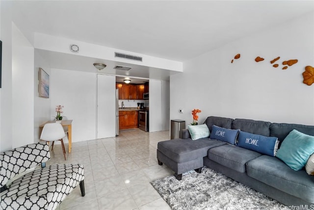 living room featuring visible vents