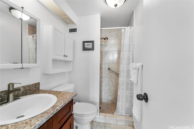 bathroom featuring visible vents, tiled shower, toilet, tile patterned floors, and vanity